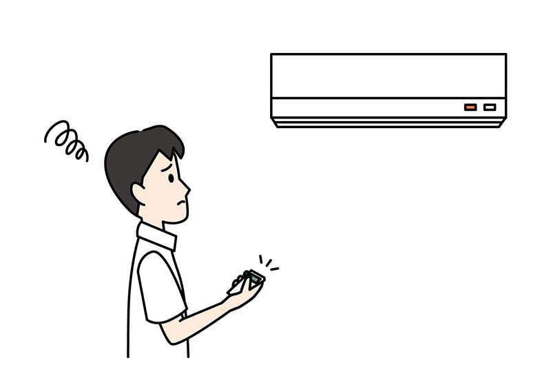 エアコンが動かず困る男性